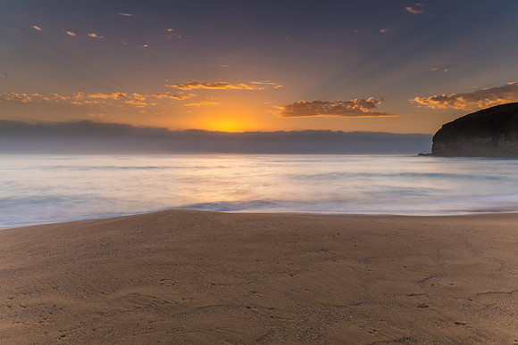 Sunrise Seascape the Beach and Low Cloud Bank