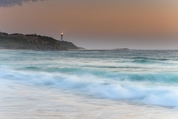 Coastal Sunrise and Lighthouse