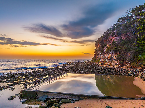 Sunrise at the seashore with colour in the clouds