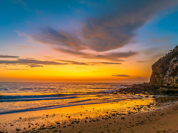 Sunrise at the seashore with clouds