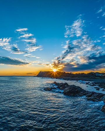 Coastal Sunrise with Rock Formations