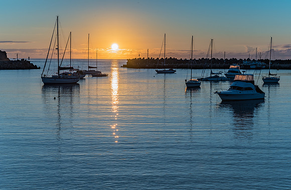 Sunrise and boats in the harbour