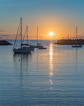 Sunrise and boats in the harbour