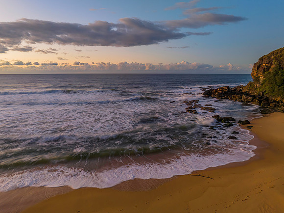 Aerial sunrise at the beach with clouds