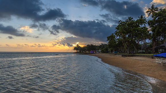 Tropical Sunset with Palm Trees in Silhouette