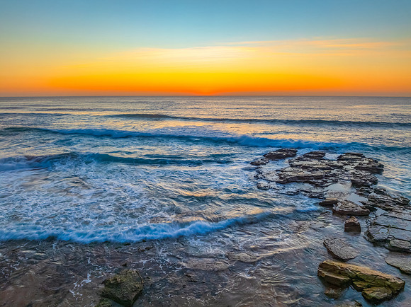Sunrise at the Seaside with an Orange Horizon