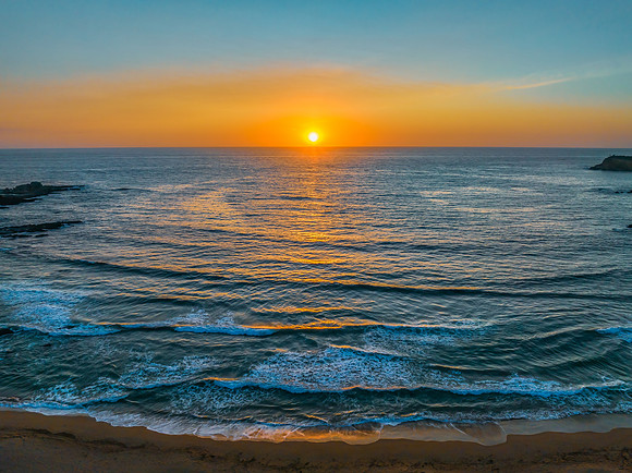 Sunrise seascape with high clouds