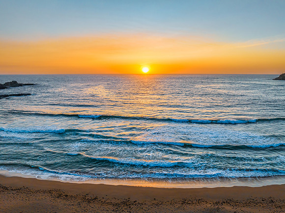 Sunrise seascape with high clouds