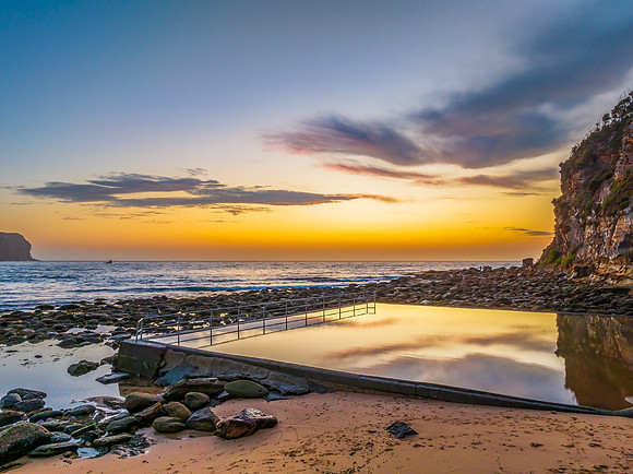 Sunrise at the seashore with colour in the clouds