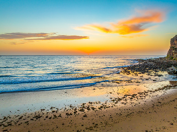 Sunrise at the seashore with clouds