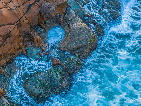 Top down sunrise over the sea and rock platform