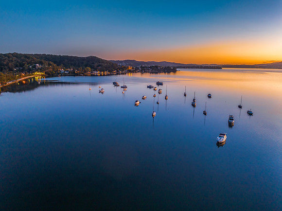 Aerial sunrise waterscape with boats