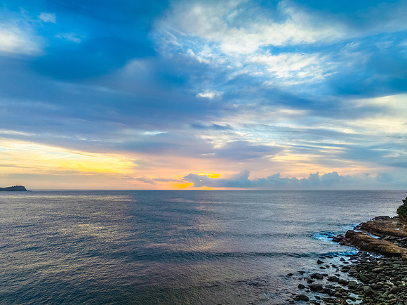 Aerial Sunrise Seascape Shrouded in Fog and High Clouds