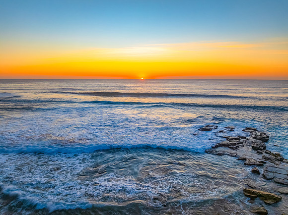 Sunrise at the Seaside with an Orange Horizon
