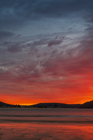 Colourful cloud filled sunrise at the seaside