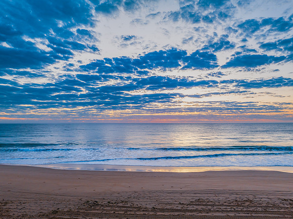 Sunrise at the seaside with clouds