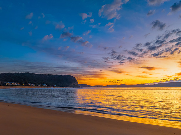 Aerial sunrise seascape with pretty cloud filled sky