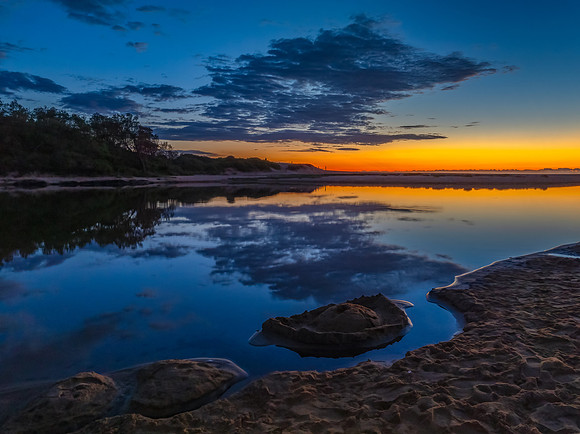Summer sunrise at the seaside lagoon