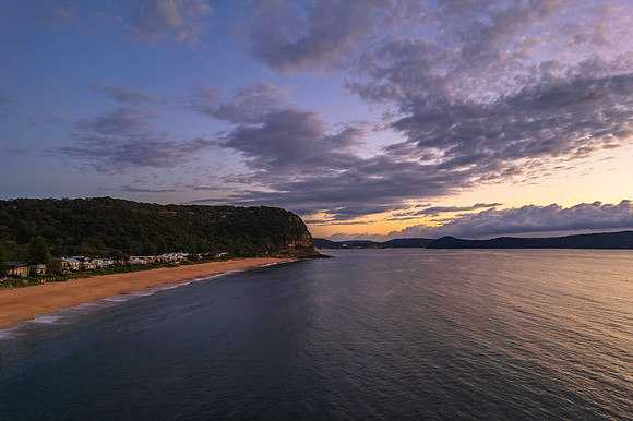 Aerial sunrise seascape with clouds