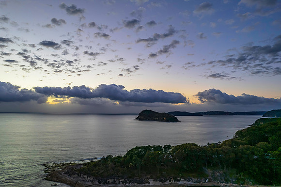 Aerial sunrise seascape with clouds