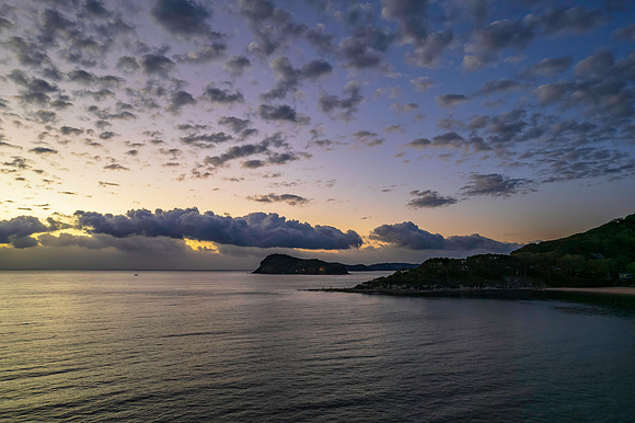 Aerial sunrise seascape with clouds