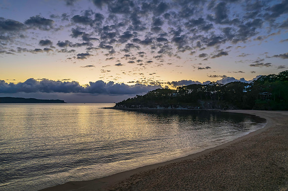 Aerial sunrise seascape with clouds