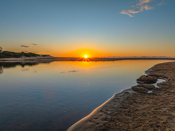 Summer sunrise at the seaside lagoon