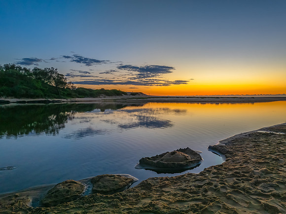 Summer sunrise at the seaside lagoon
