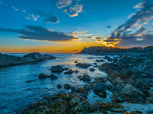 Coastal Sunrise with Rock Formations