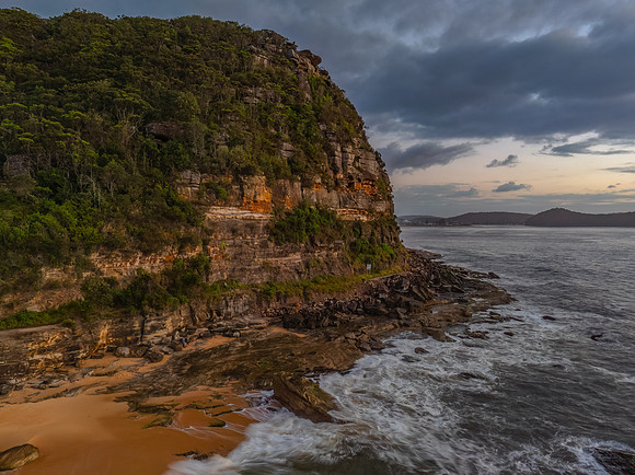 After the rain - sunrise by the mountain and ocean