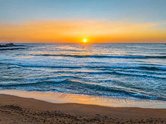 Sunrise seascape with high clouds