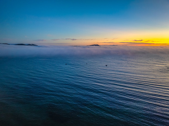 Foggy sunrise at the seaside