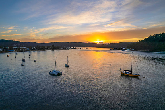 Sunrise waterscape over the channel with boats