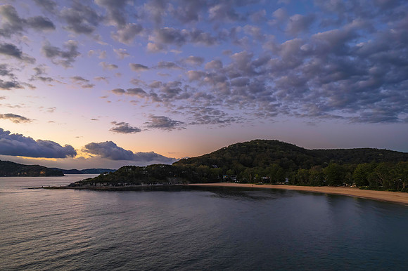 Aerial sunrise seascape with clouds