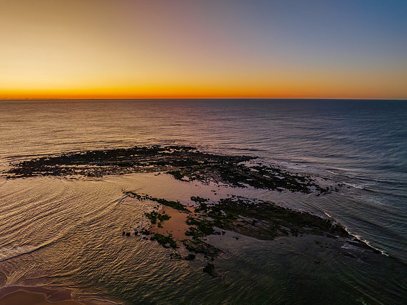 Aerial sunrise seascape with  clear skies