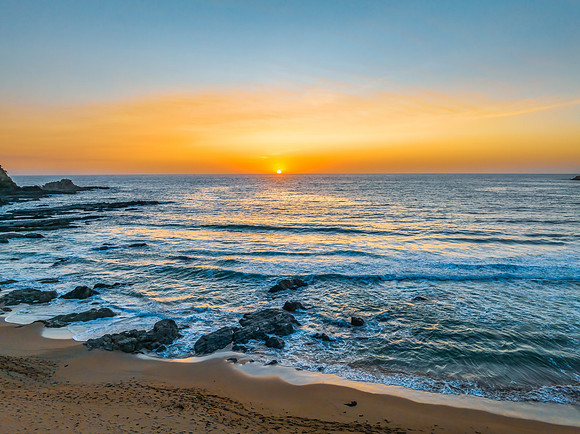 Sunrise seascape with high clouds