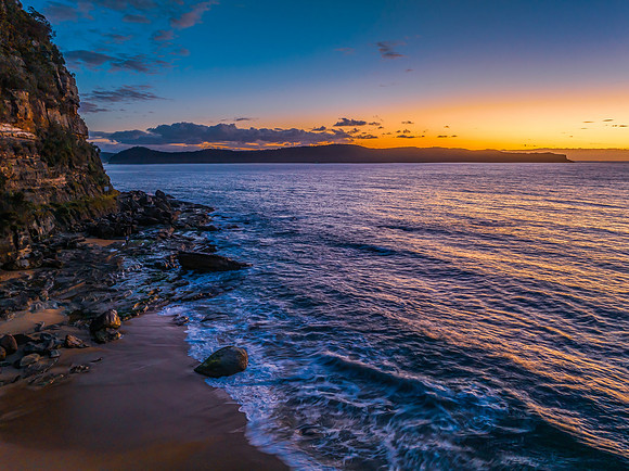 Aerial sunrise views over the ocean and beach