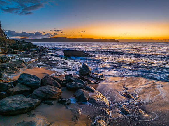 Aerial sunrise views over the ocean and beach