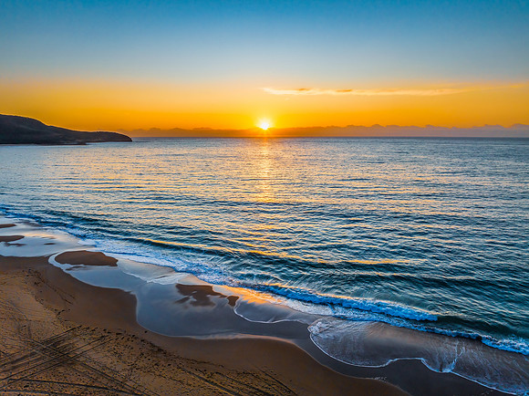 Sunrise at the seaside with orange horizon