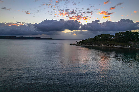 Aerial sunrise seascape with clouds