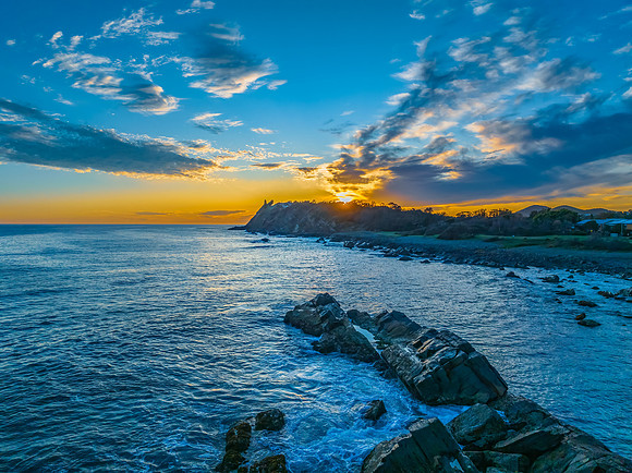 Coastal Sunrise with Rock Formations