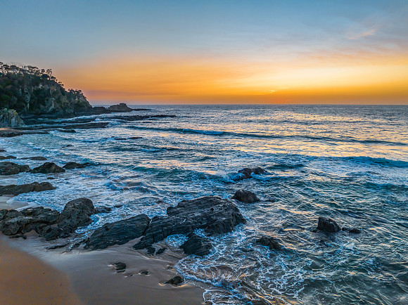 Sunrise seascape with high clouds