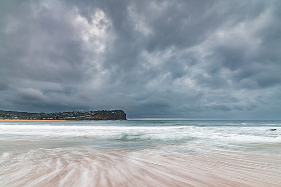 Rainy day sunrise at the beach