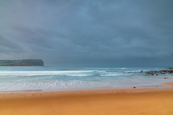 Rainy day sunrise at the beach