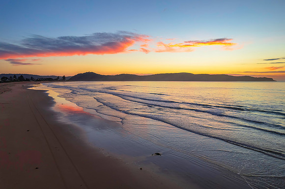 Sunrise seascape with a mix of high and medium clouds
