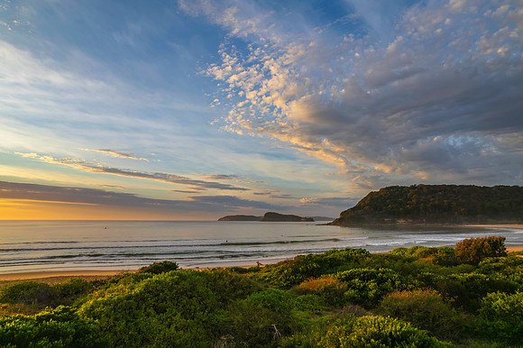 Sunrise seascape with a mix of high and medium clouds
