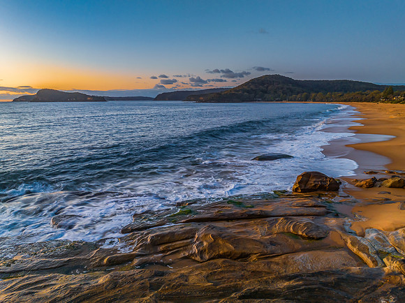 Aerial sunrise views over the ocean and beach