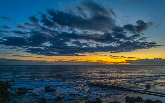 Sunrise over the ocean and rocky Inlet