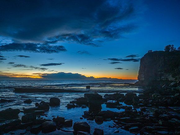 Sunrise over the ocean and rocky Inlet