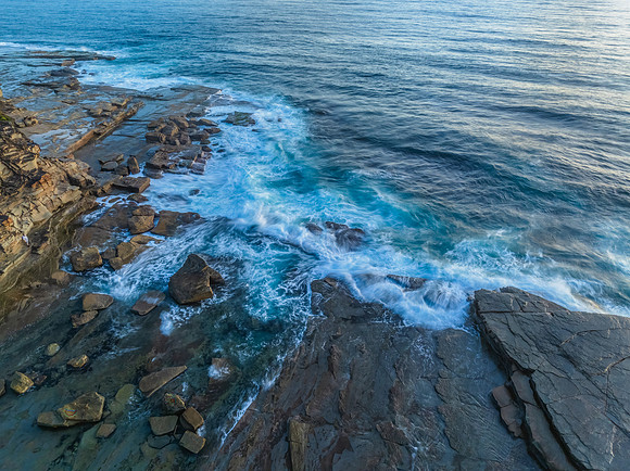 Sunrise over the ocean and rocky Inlet